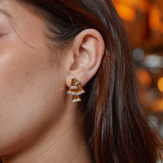 Model wearing New York Collection Art Deco Fan Diamond Gold Earrings with 56 round cut diamonds from Augustine Jewels