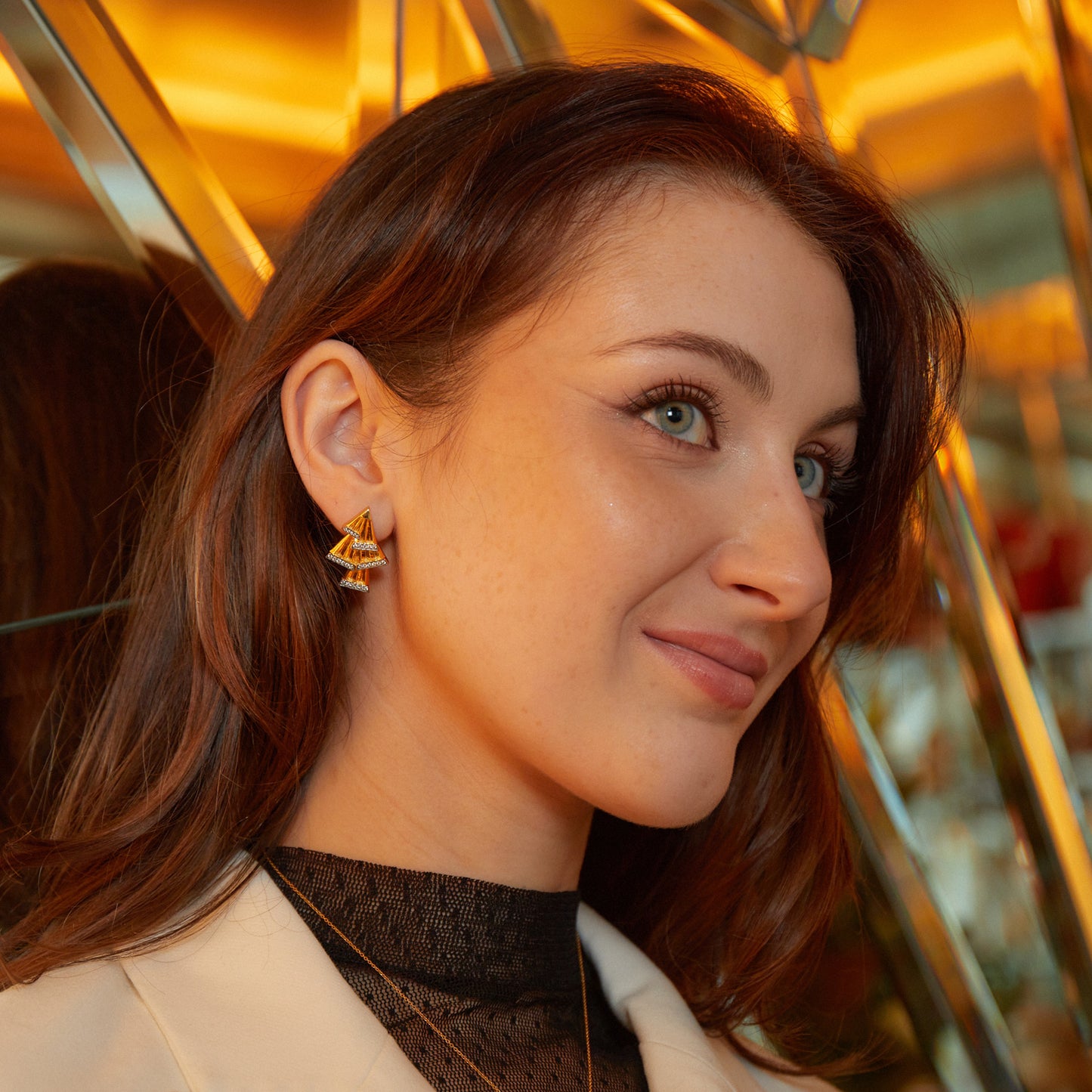 Model wearing New York Collection Art Deco Fan Diamond Gold Earrings with 56 round cut diamonds from Augustine Jewels