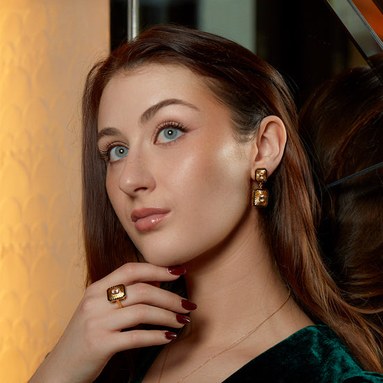 Model wearing New York Collection Art Deco Fan Diamond Gold Statement Earrings with 0.3ct and 0.5ct octagon cut diamonds and black enamel from Augustine Jewels